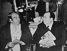 Promotional still from the film set Laughton Hitchcock.jpg