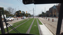 View of a green track segment from a Line 5 Eglinton light rail vehicle at Birchmount Road Line 5 Eglinton Crosstown - Green Track.png