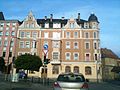 Apartment building in closed development, with restaurant "Alter Krug", corner house