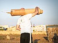 On A Duty - maltese holding his "creation" fireworks shell