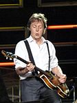 Sir Paul McCartney plays guitar left-handed