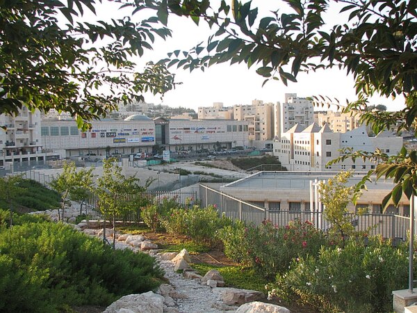 View of Pisgat Ze'ev Mall (left) and Community Center (right foreground) on Moshe Dayan Boulevard