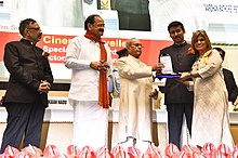 Nina Sabnani receiving Rajat Kamal Award from President Pranab Mukherjee Pranab Mukherjee presenting the Rajat Kamal Award to the Director Ms. Nina Sabnani for the Best Animation, Film Hum Chitra Banate Hai, in Non-Feature Film Section, at the 64th National Film Awards Function, in New Delhi.jpg