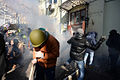 Protesters throwing brickstone in direction of the barricade line. Clashes in Kyiv, Ukraine. Events of February 18, 2014-2