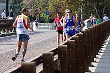 A marathon participant running backwards Retro Running (4008506566).jpg