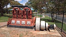 Ruston 4cyl oil-diesel engine. This ran as an engine driving an irrigation pump to draw water from the Murray River for the Coomealla Irrigation Area. It is now an exhibit. Rushton 4cyl oil-diesel engine, Dareton NSW.jpg