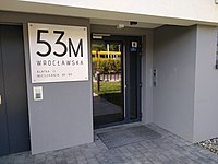 Signed entrance in a residential apartment building.jpg