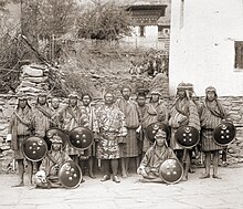 The future King of Bhutan, Ugyen Wangchuk, with his bodyguards in 1905. Sir Ugyen Wangchuck, with his bodyguards, Tongsa Dzong in Bhutan, 1905.jpg