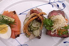 Smorrebrod, a variety of Danish open sandwiches piled high with delicacies Smorrebrod-01.jpg