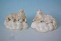 Small Staffordshire pottery figures of recumbent sheep, 2ins tall, circa 1855.