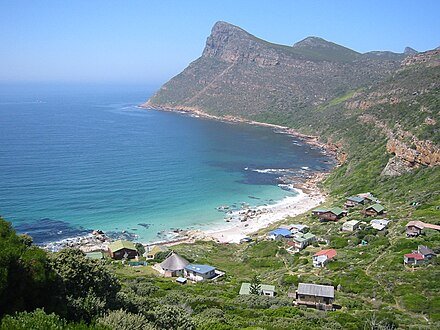 Smits Cliff is the reef below the peak on the far side of the bay in this photo