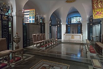 Chapel of the Order in the crypt of St Paul's Cathedral. The banners are those of the Sovereign (right) and of the Grand Master (left) of the Order. St-Pauls-Cathedral London Crypta Chapel-Order-Of-The-British-Empire-01.jpg