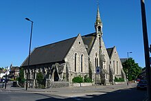 St Andrew's Church. The original rented school rooms were behind the building in the background St Andrew's, Croydon.jpg