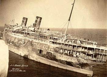 Morro Castle after the fire; photo taken from the seaward end of the Asbury Park Convention Hall pier, November 1934 Steamship Morro Castle Burned out hulk.jpg