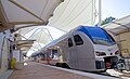 TEXRail Stadler FLIRT waiting on the platform. DFW Airport Terminal B is a TEXRail terminal station.