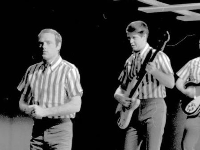 Love (left) performing with the Beach Boys, 1964