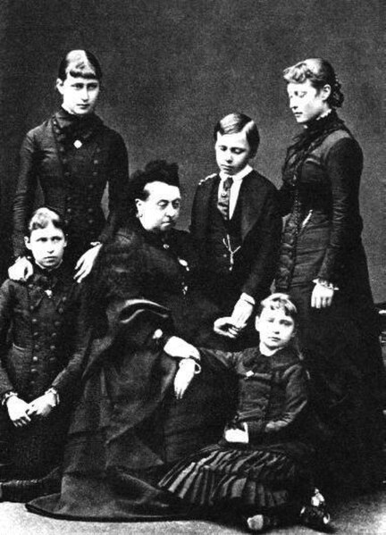 Princess Alix of Hesse, lower right, with her grandmother Queen Victoria and her four older siblings in mourning after the deaths of her mother and si