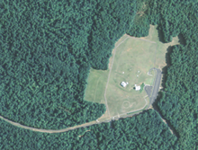 A U.S. Geological Survey satellite image shows the site of the "Big Hole" Project Office including its two above ground tropospheric scatter antennas. USGS Big Hole.png