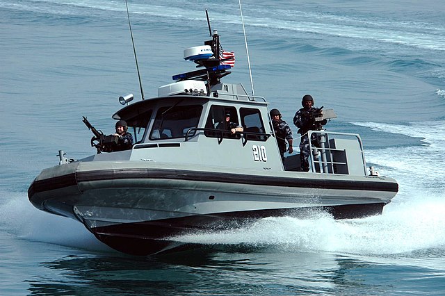 Members of Inshore Boat Unit 24 patrol near Kuwait Naval Base.