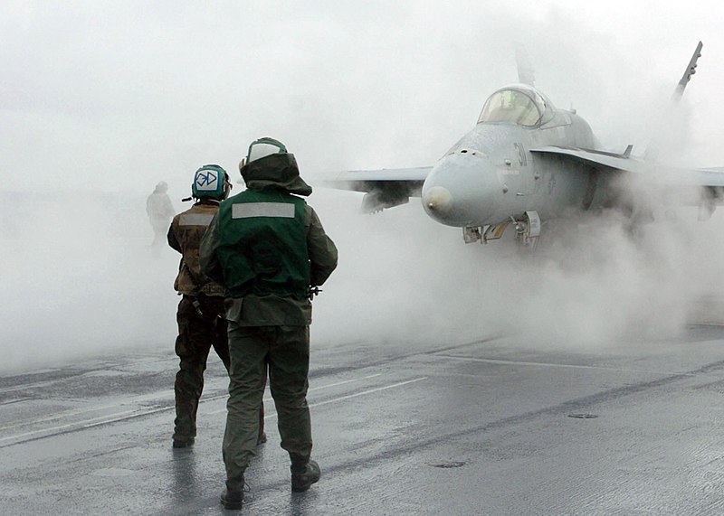 File:US Navy 051028-N-7359L-002 An F-A-18C Hornet, assigned to the Bulls of Strike Fighter Squadron Three Seven (VFA-37), is directed onto a steam-powered catapult.jpg