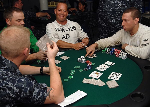 A game of Texas hold 'em in progress. "Hold 'em" is a popular form of poker.