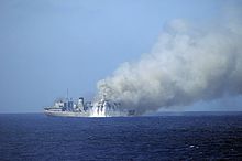 Rounds from a Mk-15 Phalanx CIWS from the guided missile destroyer USS Mitscher hit ex-USNS Saturn during a sinking exercise (SINKEX), 2010.