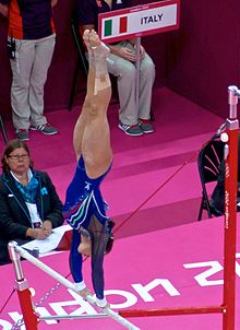 Fasana competing on the uneven bars during qualification at the 2012 Summer Olympics on 29 July 2012 Uneven bars.jpg