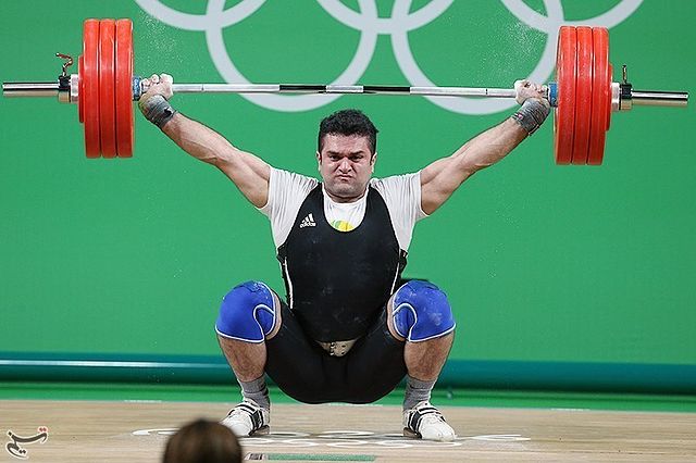 Mohammad Reza Barari, an Iranian lifter, snatching at the 2016 Olympic Games in Rio, Brazil