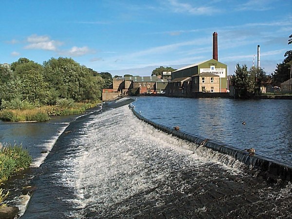 Weir on the River Wharfe at Otley with Garnett's paper mill behind