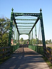 Restored truss bridge along the White Lick Creek Trail in Plainfield WhiteLickCreekTrail Plainfield Indiana.jpg