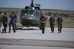 Civil Air Patrol cadets take turns riding in a UH1 from F.E. Warren Air Force Base. Wyoming Civil Air Patrol Encampment DVIDS307956.jpg