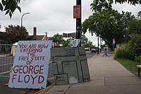 A map and a sign on Chicago Avenue stating, "You are now entering the Free State of George Floyd", May 30, 2022 You are now entering the Free State of George Floyd (51247255147).jpg