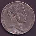 I. Vilmos király ezüst 3 guldenes érméjének előoldala az uralkodó portréjával, 1820-ból.