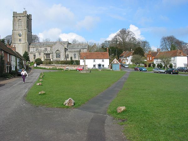 Houses round the village green, overlooked by the church