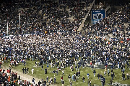 Fans storming the field at LaVell Edwards Stadium in 2009 after No. 19 BYU beat No. 21 Utah 26–23 in overtime