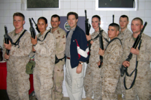 Brownback posing with U.S. Marines in Iraq Brownback IRaq.png