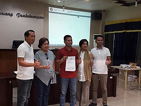 Cari (center) with his father and outgoing Leyte's Fifth District Representative (left) and grandmother and outgoing Baybay Mayor (second from left) Cari Proclamation.jpg