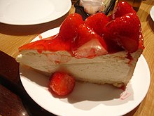 New York-style cheesecake with strawberries. Other variations include blueberry or raspberry sauce. Carnegie Deli Strawberry Cheesecake.jpg