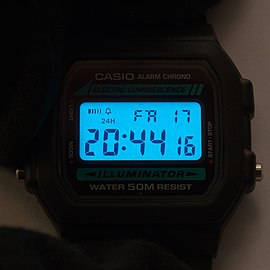 A Digital LCD watch with electroluminescent backlight.
