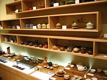 A collection of gaiwan, tea trays, Yixing teapots and other tea utensils Chinese tea utensils shelve.jpg