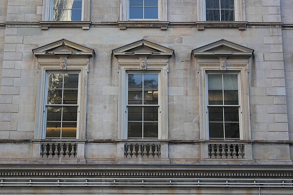 Detail of second-floor windows in a projecting section of the facade