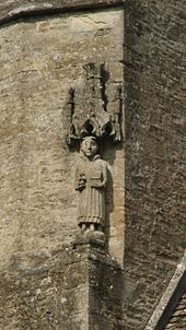 Medieval statue of St Stephen on the church tower