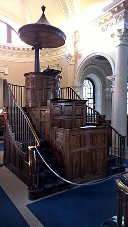 Centrally-placed three-decker pulpit at Gibside Chapel, England, a private chapel on the Calvinist edge of Anglicanism. Gibside Chapel interior 2018 - pulpit.jpg