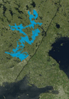 Saimaa highlighted on a satellite photo, Gulf of Finland at the bottom, Lake Ladoga on the right. The black line is the Russo-Finnish border.