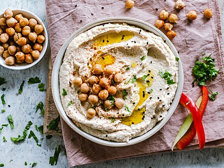 Hummus dip with chickpeas, sesame seeds, and oil