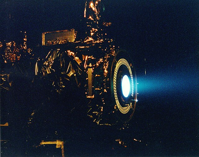 NASA's 2.3 kW NSTAR ion thruster for the Deep Space 1 spacecraft during a hot fire test at the Jet Propulsion Laboratory