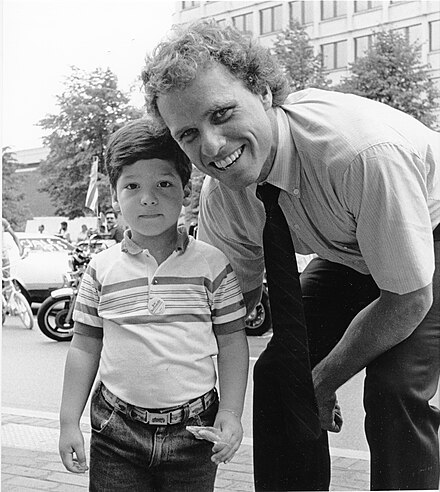 Kennedy with a child in Boston, 1980s