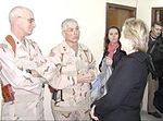 Taluto and 116th Brigade Combat Team commander Alan Gayhart greet Senator Hillary Clinton at Forward Operating Base Warrior, February 20, 2005 Joseph Taluto Hillary Clinton.jpg