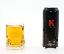 The cider and an example of a K cider can K cider can and glass.JPG