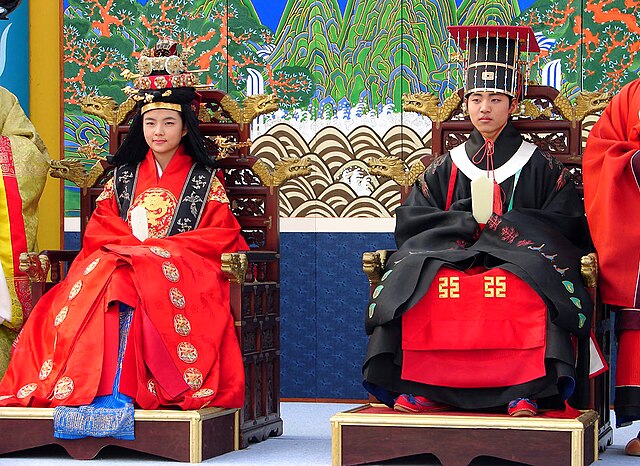 Traditional Korean royal wedding ceremony with the male royal wearing royal costume